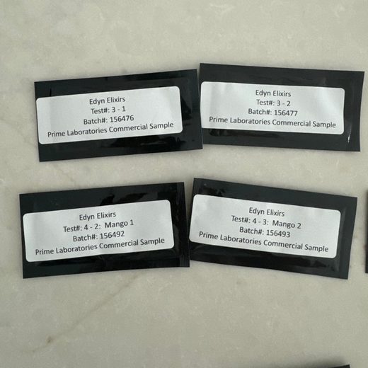Four Edyn Elixirs test packets from Prime Laboratories, including two mango batches